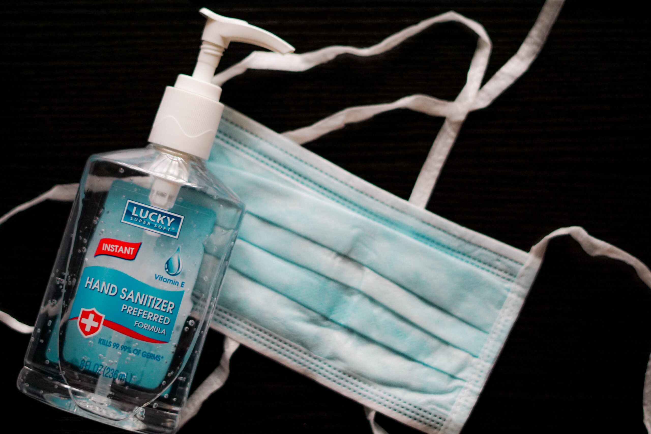 Face mask and bottle of hand sanitiser